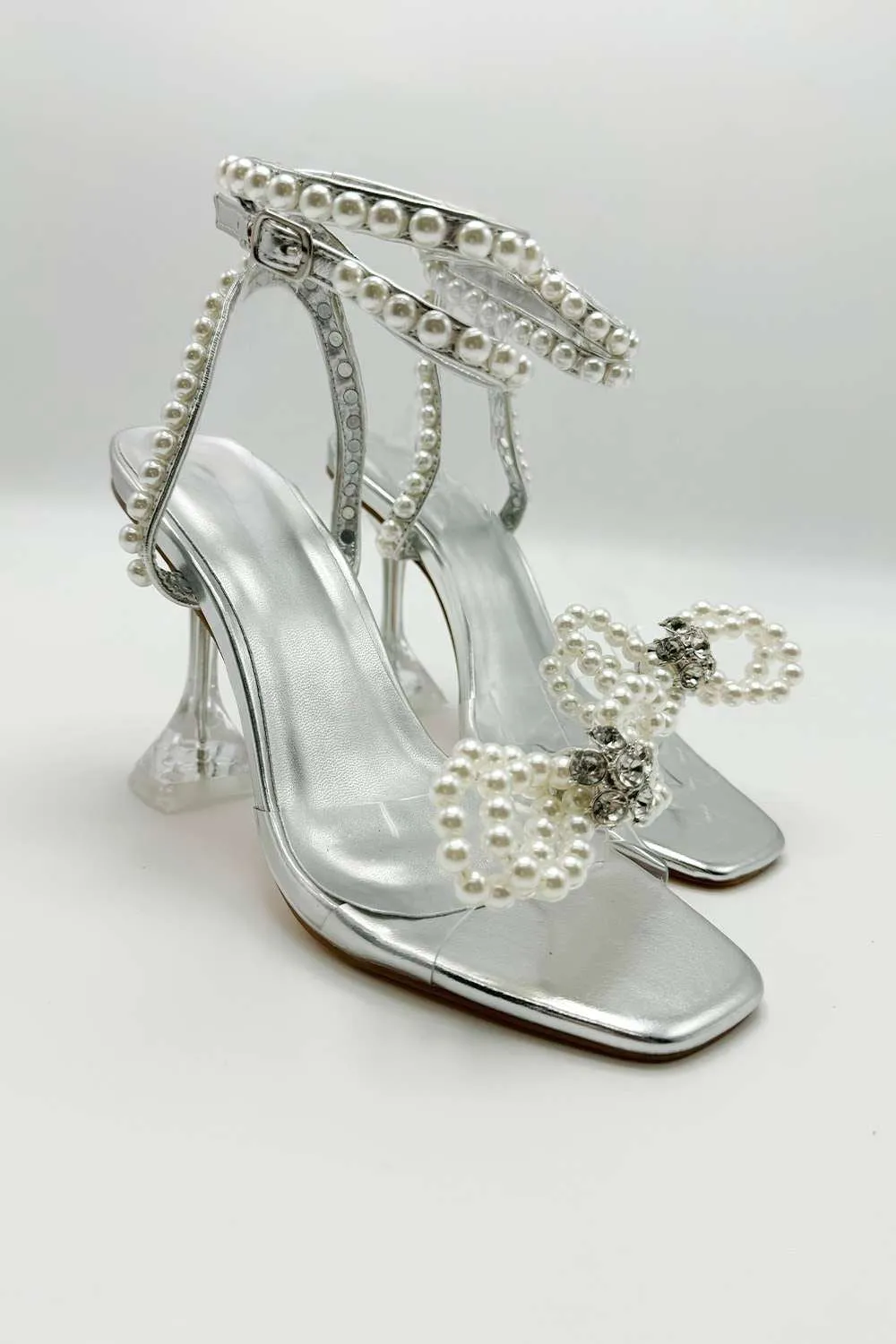 Pearlie Perspex Faux Pearl Bow Detail Heeled Sandals in Silver