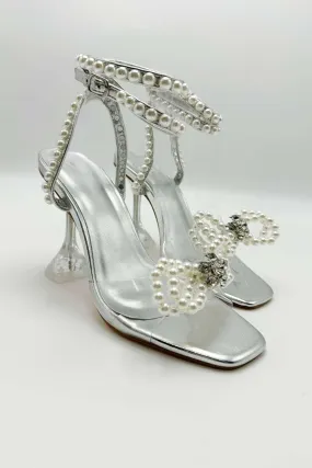Pearlie Perspex Faux Pearl Bow Detail Heeled Sandals in Silver